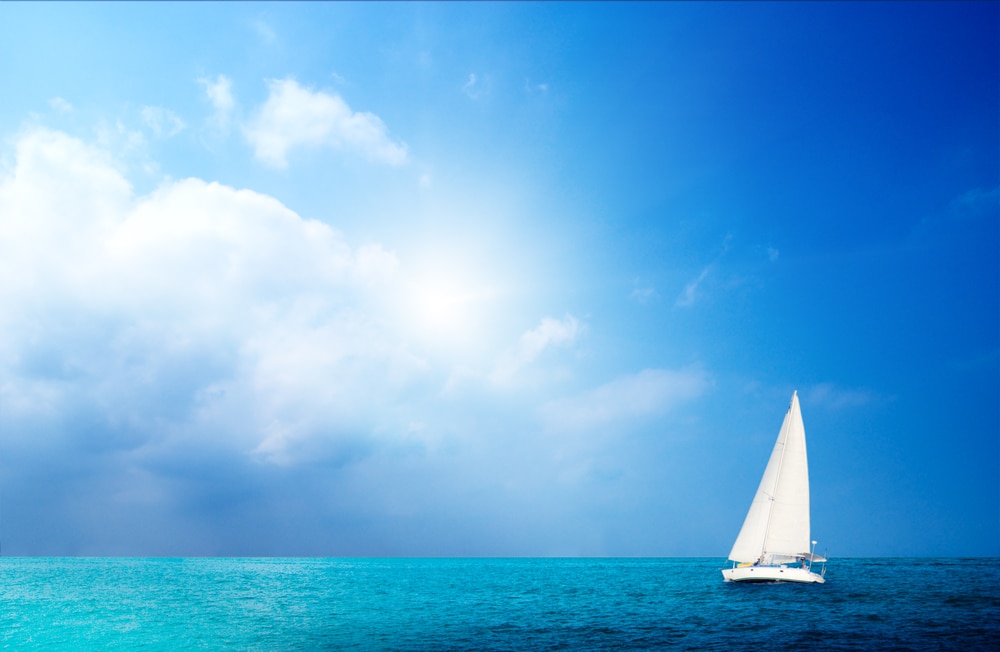 sail boa on blue ocean with blue sky