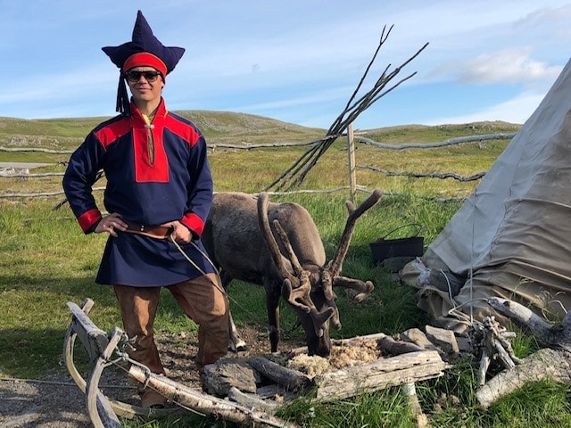 indigenous sami people with reindeer