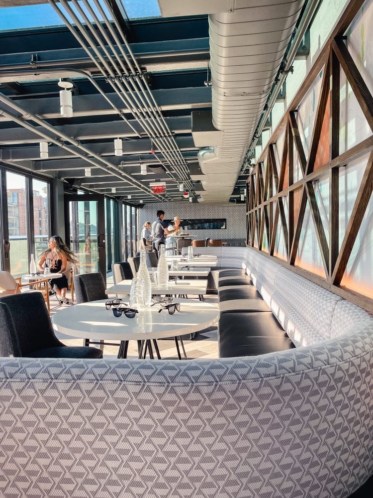 interior seating in the solarium area of altitude sky bar at astra hotel in seattle